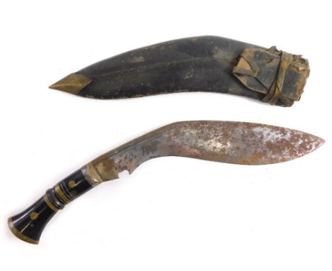 A 20thC kukri, with shaped blade, turned handle and leather scabbard, 41cm long. 