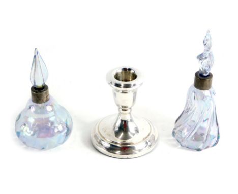 Two similar lustre glass scent bottles and stoppers, each with a silver collar Birmingham 1988 and a dwarf silver candlestick
