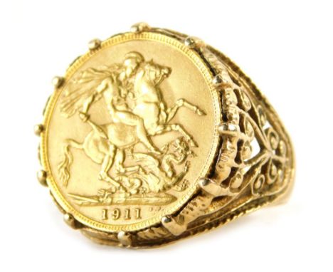 A George V gold full sovereign 1911, in 9ct gold basket weave ring setting, size W, 15.6g all in. 