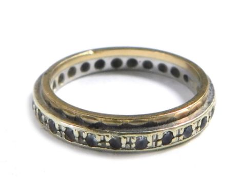 A 9ct gold eternity ring, two line design set with cz's, size K½, 2.4g. 