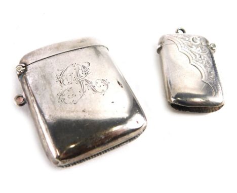 An Edward VII silver Vesta case, Birmingham 1905, bright cut with flowers with ring top, 4cm high, and another Vesta case, 1.