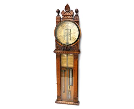 An early 20thC Admiral Fitzroy oak cased improved barometer, with 25cm diameter main dial, mercury column and thermometer, in