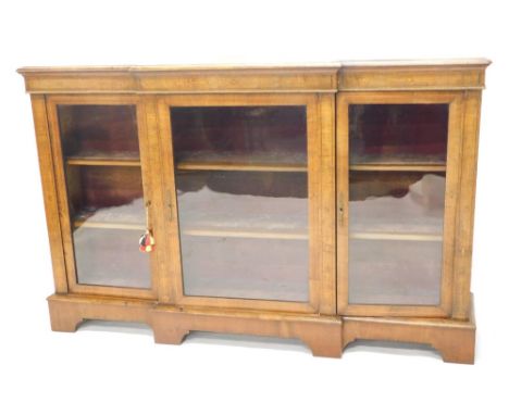 A Victorian walnut breakfront credenza, with giltwood rope twist moulding, above a central door, flanked by two further doors