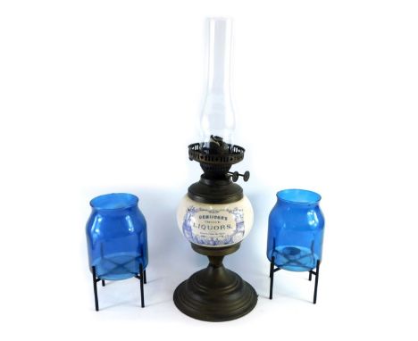 A Demijohn's Choice Liqueurs advertising oil lamp, with pottery reservoir, brass mounts and plain glass funnel, and two glass