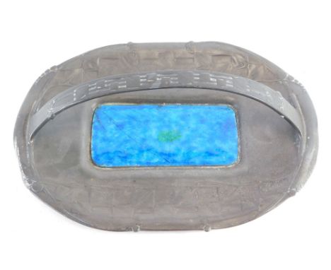 An Early 20thC English pewter basket, by Archibald Knox, with fixed handle and green and blue enamel centre, the oval body ra