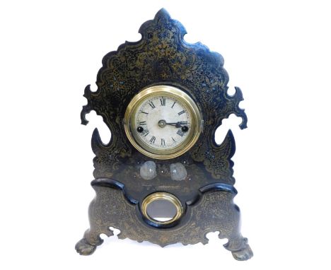 A late 19thC American mantel clock by the Waterbury Clock Company, in a black toleware case, decorated in gilt to simulate pa