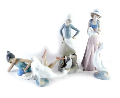 Various Lladro and Nao figures, Nao figure of a recumbent ballerina, 23cm long, further figure of lady holding puppy, Lladro 