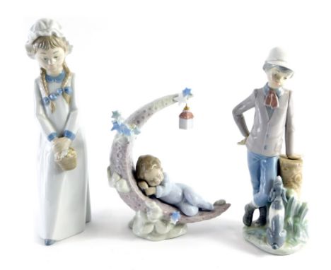 A Lladro figure group of a sleeping child, on crescent moon with hanging lantern, number 6479, printed and impressed marks be