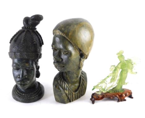 A carved tribal figure, wearing plain hat, 30cm high, another in elaborate head dress and a jade style figure of a lady. (3) 