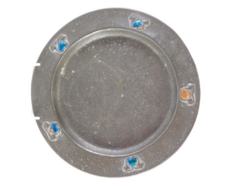 An early 20thC Liberty Tudric pewter plate, attributed to Archibald Knox, the plain border broken by raised enamel heart shap