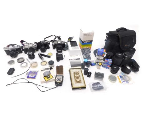 Various cameras and related equipment, a case containing a quantity of lenses, to include Pentax, Vivitar lens, a Praktica ca