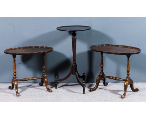 A mahogany circular tray top tripod occasional table with moulded edge to top, on turned and stop fluted central column, with