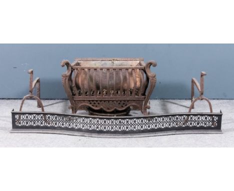 A 19th Century cast iron fire grate with shaped front, shaped and pierced apron and on scroll feet, 24ins wide x 13ins deep x