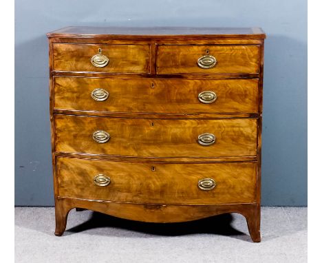 A late Georgian mahogany bow front chest, the top with wide satinwood crossbanding and reeded edge, fitted two short and thre