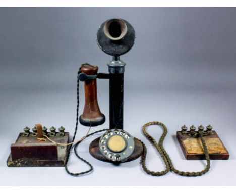 An early candlestick telephone demonstration set, the base fitted with bulb for call indicator, together with chords and term