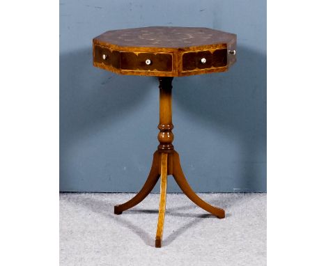 An octagonal burrwood and oysterwood tripod occasional table, with segmented top and inlaid with stringings, fitted two real 