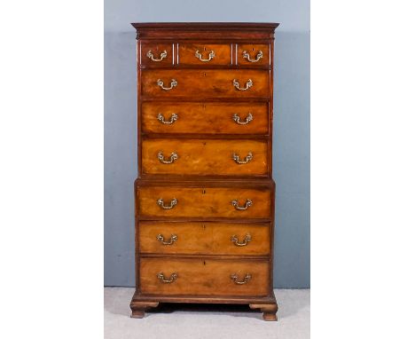A George III mahogany tallboy, the upper part with moulded cornice, fitted three short and three long drawers, the base fitte