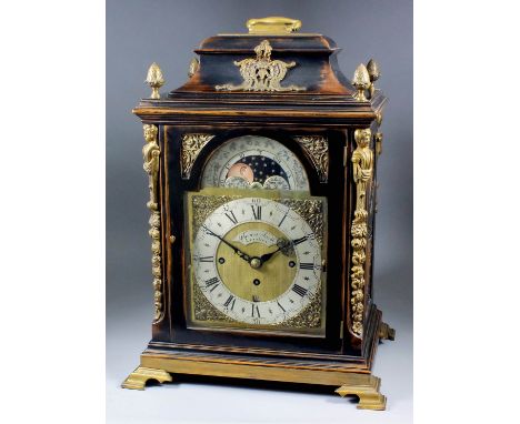 A late Victorian ebonised and gilt brass mounted mantel clock of "18th Century" design by Thomas Smith of London, the 8ins ar