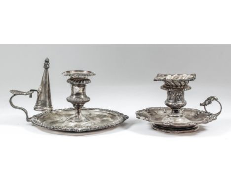 A late Victorian silver circular chamber candlestick with gadroon shell and scroll mounts and scroll handle, 6.5ins diameter 