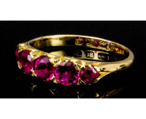 A late Victorian 18ct gold mounted five stone ruby ring, the stones of graduated form (estimated weight 2.1ct), (size Q - gro