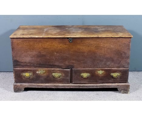 An 18th Century oak mule chest, fitted two drawers to base, on bracket feet, 51ins x 21ins deep x 26.25ins high (faded)