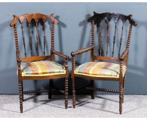A pair of 19th Century Dutch children's rosewood armchairs with shaped crest rails on bobbin turned uprights and with four sp