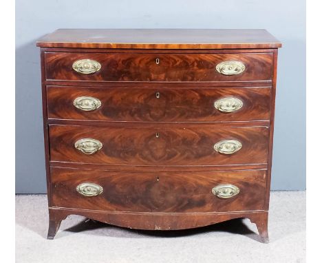 A George III mahogany bow front chest, the top crossbanded and inlaid with stringings, fitted four long graduated drawers, on