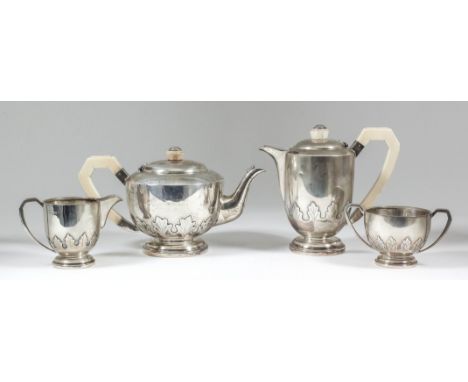 George V Harlequin silver circular four piece tea service of Art Deco design, the lower bodies embossed with leaf ornament, i