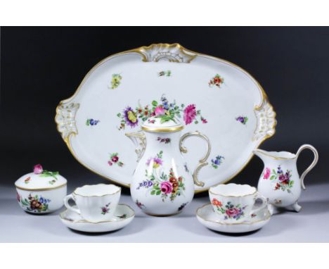 An early 20th Century German cabaret coffee service and tray, enamelled in colours in the Meissen manner with Deutsche Blumen