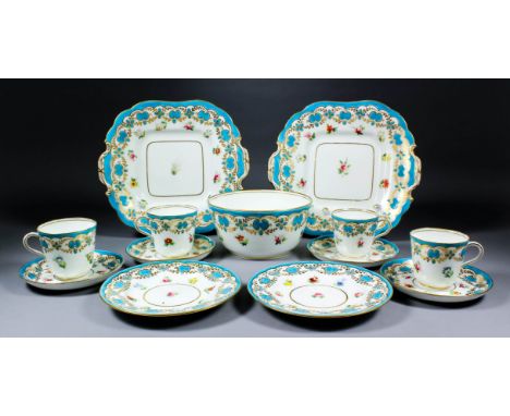 A late 19th Century English porcelain part tea service, enamelled in colours with single flower sprays, and gilt and turquois