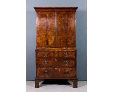 A George II walnut Secretaire cabinet, the front matched figured veneer panels inlaid with herringbone bandings and crossband