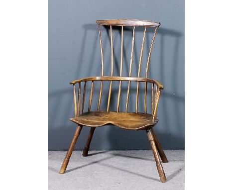 A 19th Century ash and elm primitive two tier stick back Windsor armchair (probably of West Country origin) with slightly ang