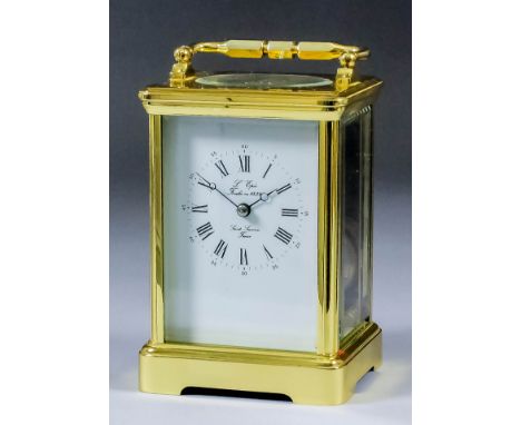 A modern L'Epee carriage clock, the white enamel dial with Roman numerals to the eight day to train movement striking on a go