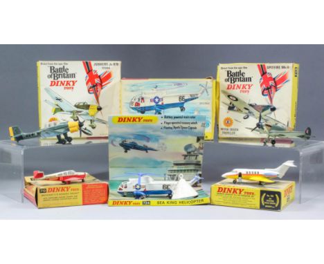 A collection of Dinky Toys diecast model aircraft, including - MKII Spitfire No.719 (boxed), a Junkers Ju 87B Stuka No.721 (b