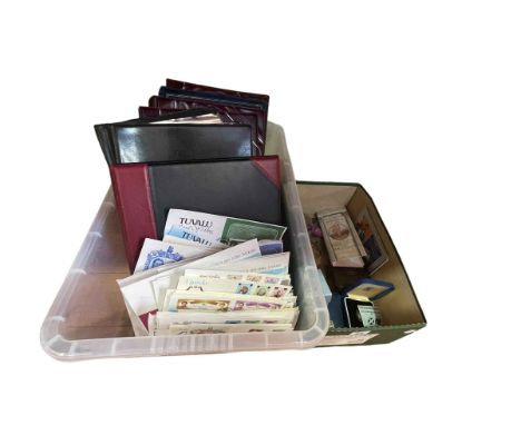 Two boxes of stamps, first day covers, coins including silver commemorative two pounds.