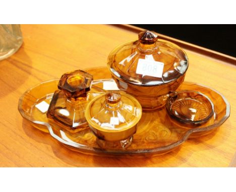 Davidson cloud amber boudoir tray with pin tray, large and small lidded bowls and short candlestick.
