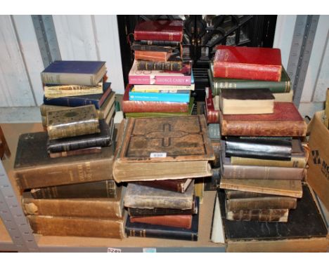 Shelf of vintage books including bibles