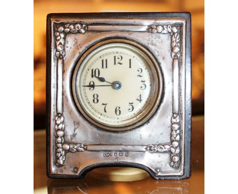 Small travelling clock with built in folding stand and winder, silver front to clock face, assay Birmingham 1949, maker Josep