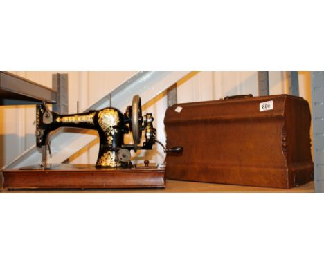Vintage wood cased Jones hand powered sewing machine
