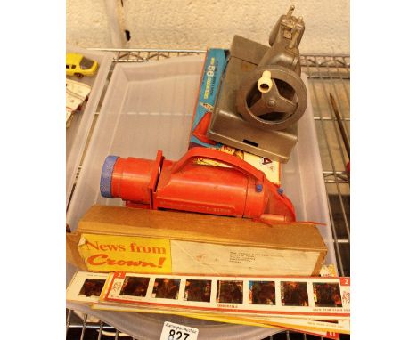 Two vintage children's slide projectors with colour slides and a child's Vulcan sewing machine 