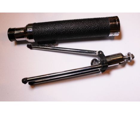 Telescope on tripod in leather case