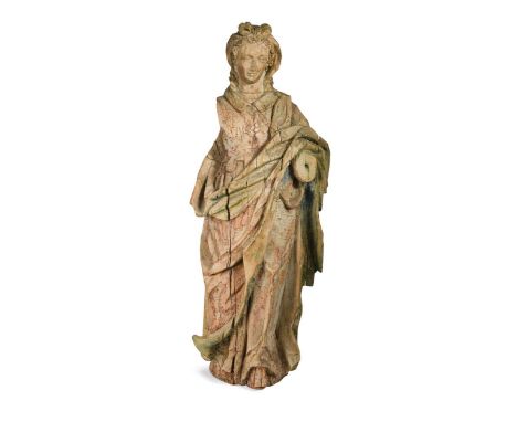 A carved and painted softwood figure of a lady, perhaps French 17th century, standing in heavy robes, her inner waistcoat wit