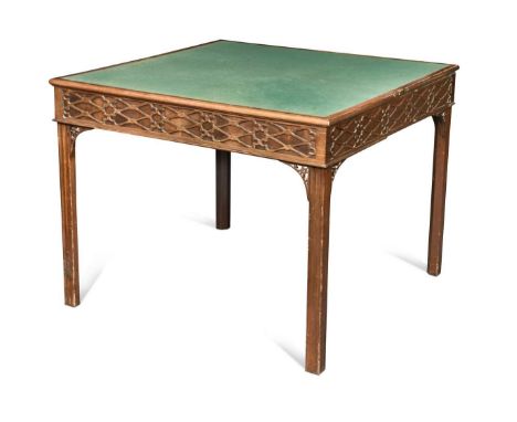 A mahogany blind-fret carved card table, 19th century,  with concertina action, the rectangular fold-over top enclosing a gre