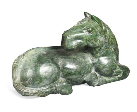 A Chinese spinach jade type recumbent horse, Ming style,  16 x 42cmThe tail with slight knock damage in several places, with 