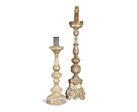 An Italian carved and silvered wood tripod pricket candlestick, 18th/19th century, with scrolled and leaf enriched base, leaf