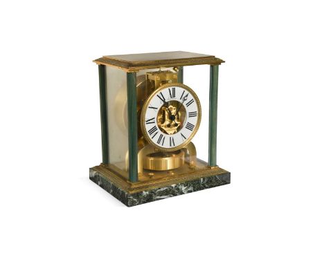 A Jaeger-LeCoultre Atmos clock,  the lacquered brass glazed case with white chapter ring, flanked by reeded green stained col