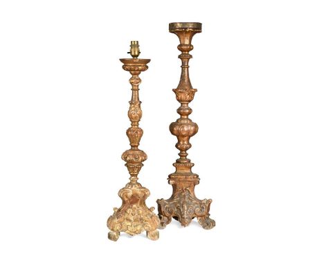 An Italian carved giltwood and gesso altar candlestick, 18th century, with acanthus enriched knopped stem, on tripod feet, co