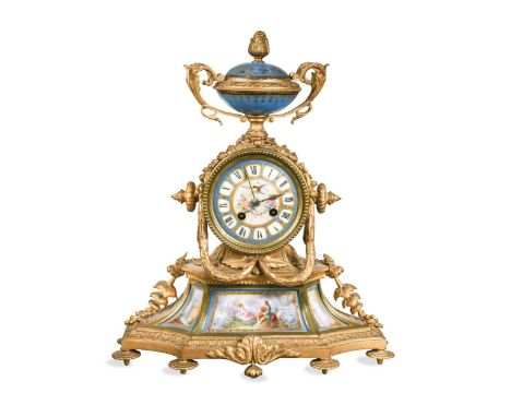 A French ormolu and Sèvres style mantel clock, 19th century, the Louis XVI design case with blue urn above a painted dial wit