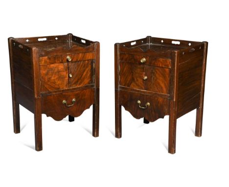 A pair of George III mahogany tray-top night tables, each with a pierced gallery above a single drawer, pair of cupboard door