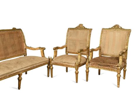 A three piece giltwood salon suite after George Jacob, 19th century, to include a two-seat canape and a pair of matching faut